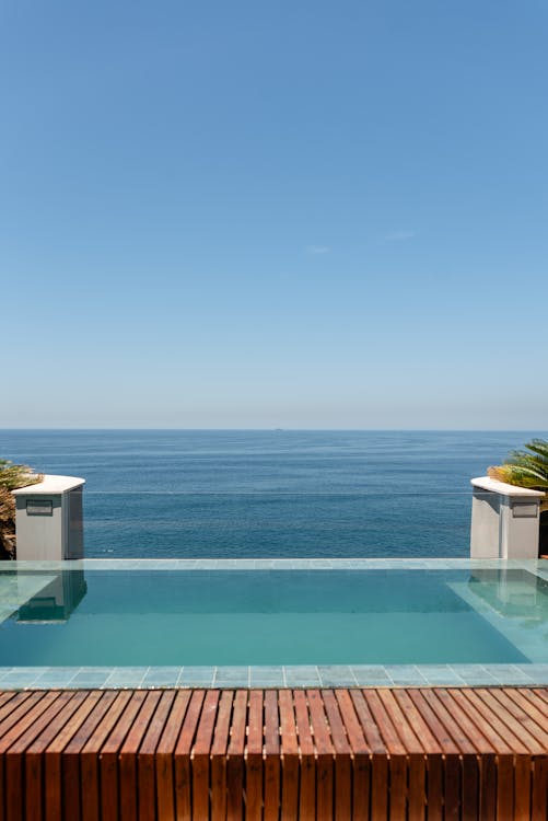 Modern pool with blue water in a tropical setting