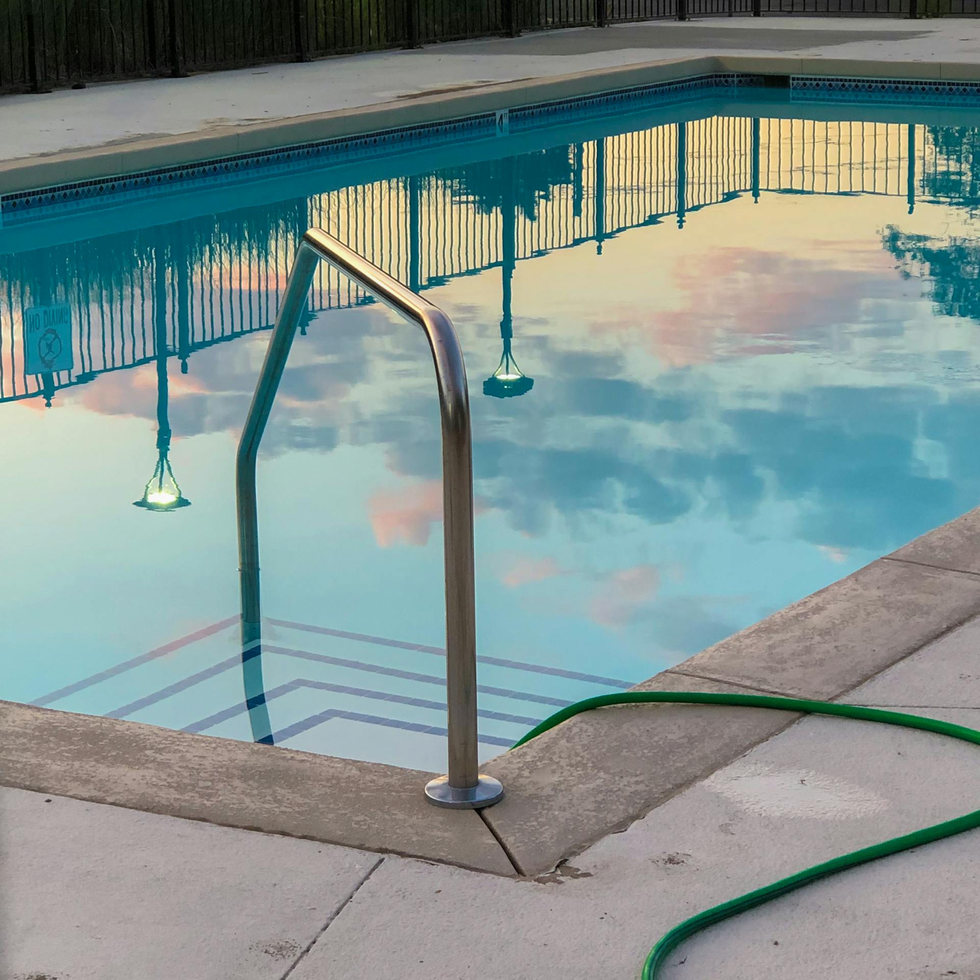 Pool leak detection in Hawaii — technician testing for leaks around a residential pool