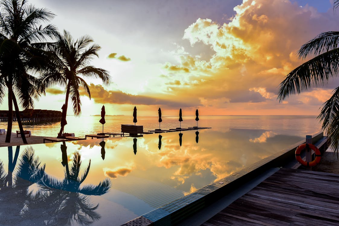Crystal clear pool with pristine surface in tropical Hawaii yard