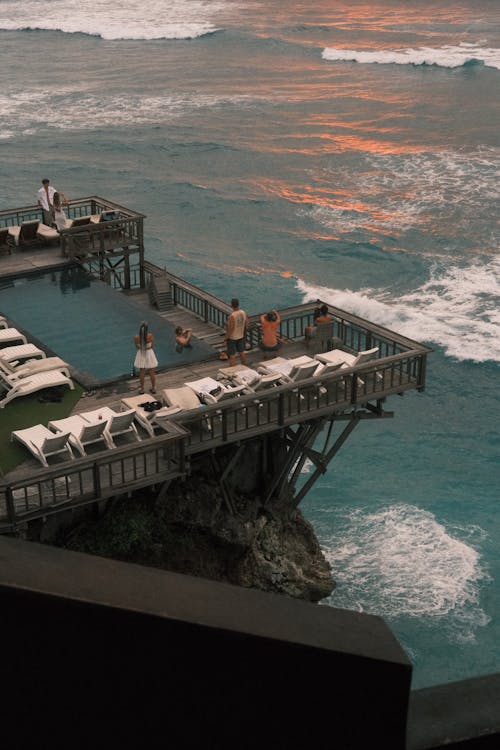 Sparkling pool with palm trees reflecting in clear water